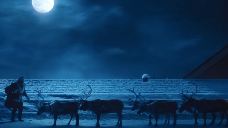 Santa reindeer rooftop moon
