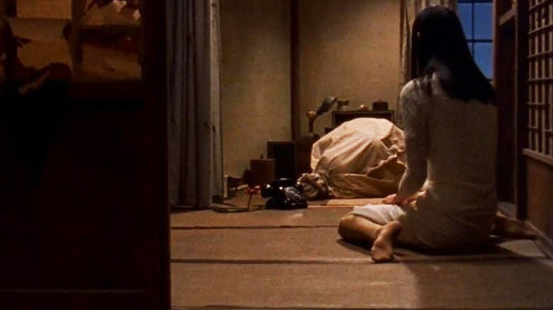 Eihi Shiina crouched by bag Audition