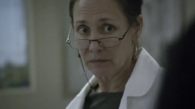 Laurie Metcalf as Dr. Jenna James lifting her brows and peering over her glasses on Getting On
