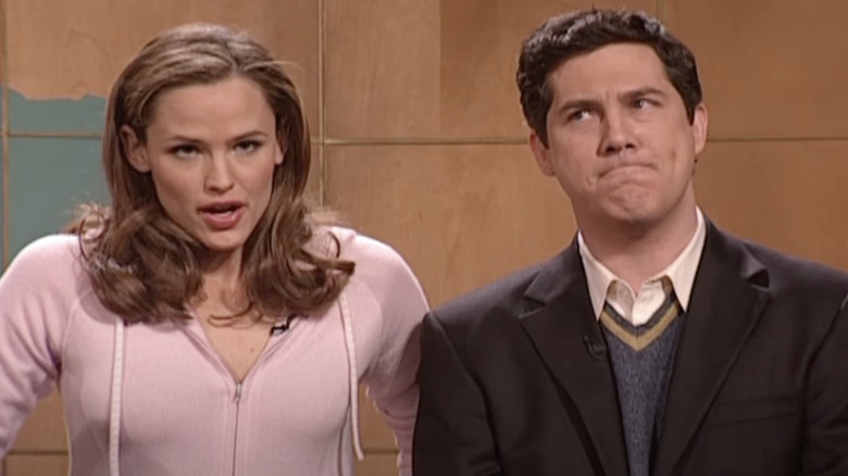 Jennifer Garner standing next to Chris Parnell during Weekend Update on SNL