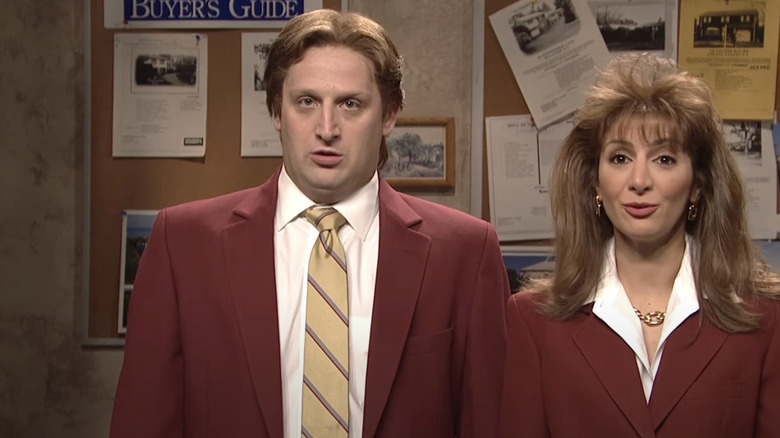Tim Robinson and Nasim Pedrad as Burt and Blair standing next to each other on SNL