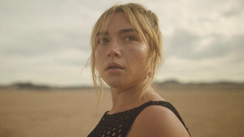 Florence Pugh looks off into the distance