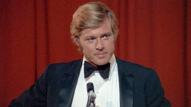 Bill McKay answering questions in a tuxedo in The Candidate