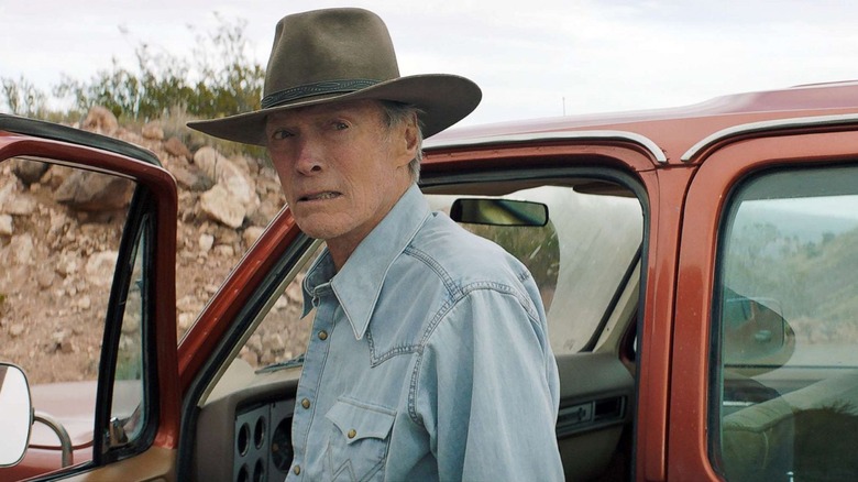 Mike Milo (Clint Eastwood) grimaces by his truck in Cry Macho