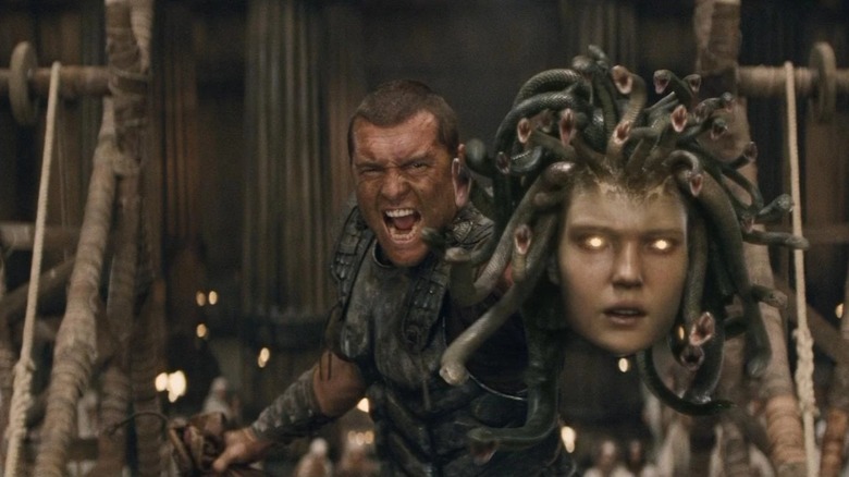 Sam Worthington's Perseus holds a pure-CGI Medusa head while screaming in Clash of the Titans