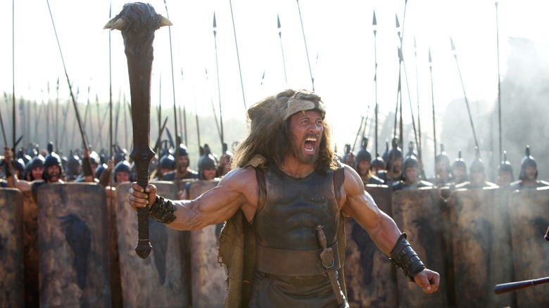 Dwayne Johnson wears a fake lion skin and holds a resin club in the 2014 Hercules.