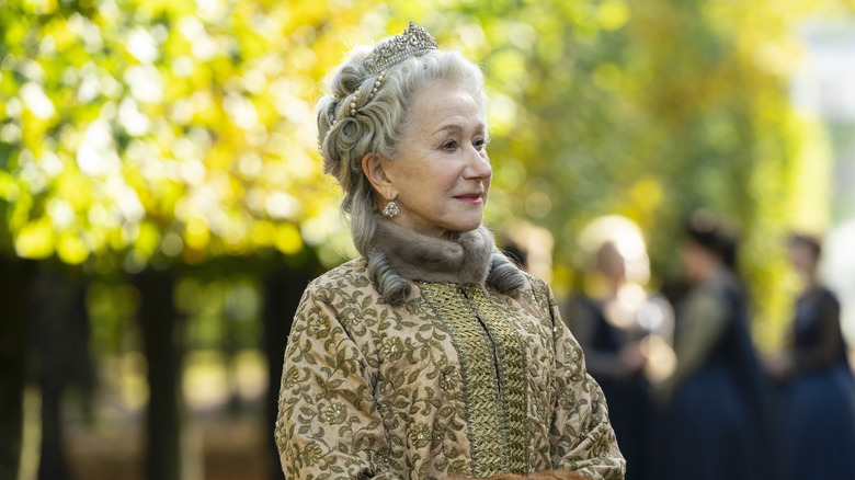 Helen Mirren as Catherine the Great walking and smiling on Catherine the Great