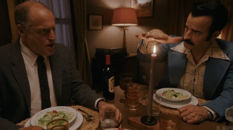 Woody Harrelson as E. Howard Hunt and Justin Theroux as G. Gordon Liddy sitting at a dinner table on White House Plumbers
