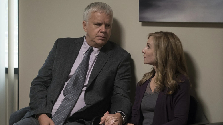 Tim Robbins and Holly Hunter as Greg and Audrey siting and holding hands on Here and Now