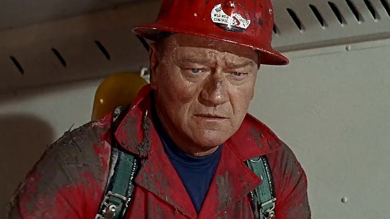 John Wayne as Chance Buckman, staring into the middle distance in Hellfighters.