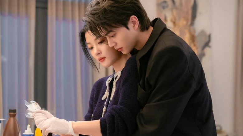 Jeong Gu-won (Song Kang) embraces Do Do-hee (Kim Yoo-jung) from behind in My Demon