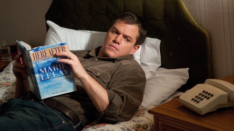 George (Matt Damon) reads a book entitled Hereafter in the movie Hereafter