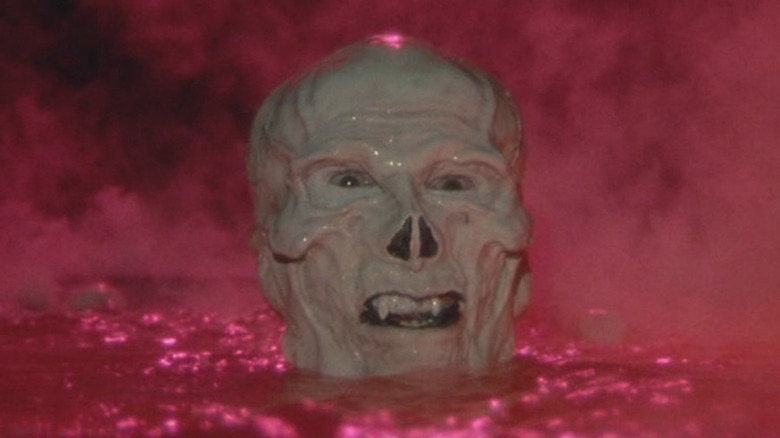 Skeletor (Frank Langella) emerging from liquid in Masters of the Universe