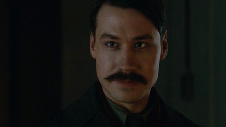 Adolf Hitler (David Kross) in the shadows in The King's Man