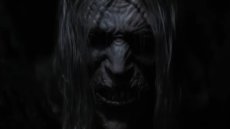 Knull (Andy Serkis) in shadows in Venom: The Last Dance