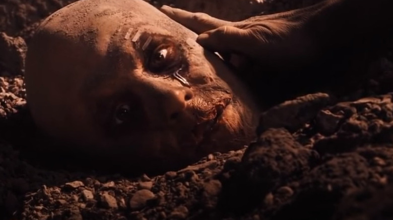 Deadpool's (Ryan Reynolds) decapitated head in gravel in X-Men Origins: Wolverine