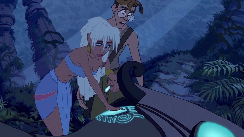 Princess Kida touches an Atlantian hover craft as Milo stands next to her in Atlantis: The Lost Empire