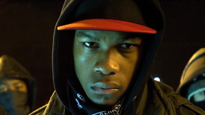 John Boyega staring into a camera lens from Attack the Block 