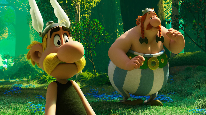 Asterix (Alain Chabat) and Obelix (Gilles Lellouche) look surprised in a forest in Asterix and Obelix: The Big Fight