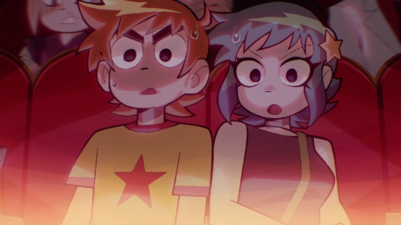 A sweating Scott Pilgrim (Michael Cera) and Ramona Flowers (Mary Elizabeth Winstead) stare shocked down at a glowing light in Scott Pilgrim Takes Off