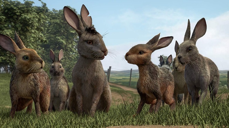 A group of rabbits gather on a grassy hill in Watership Down (2018)