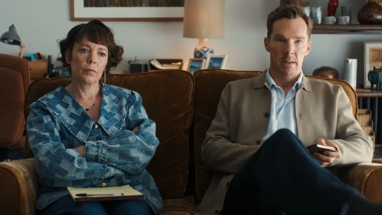 Olivia Colman and Benedict Cumberatch as Ivy and Theo sitting on a couch together in The Roses