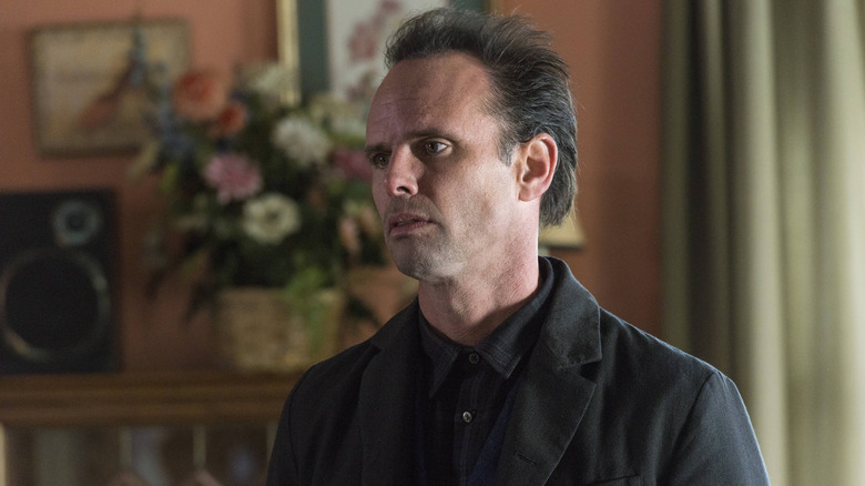 Walton Goggins black clothes flowers