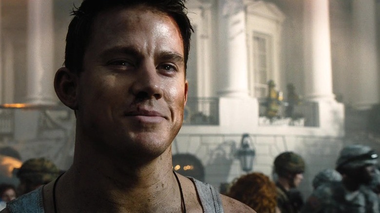 A dirty Channing Tatum smirking outside the White House