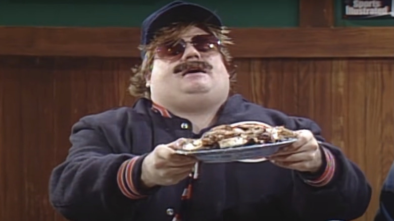 Chris Farley holding plate