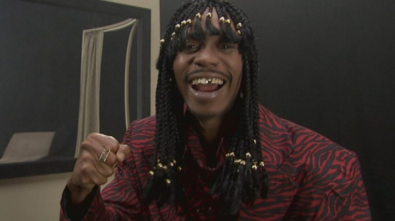 Rick James (Dave Chappelle) showing off his gold tooth on Chappelle's Show