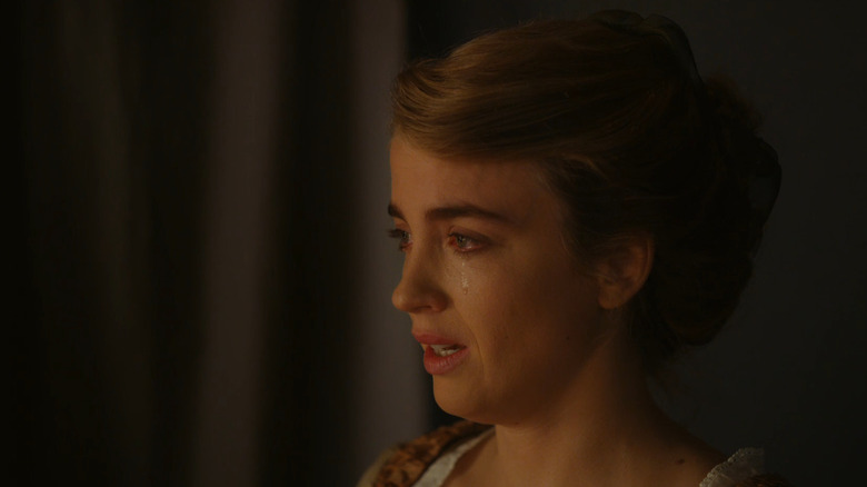 Profile of Adèle Haenel as Héloïse crying and looking at something in Portrait of a Lady on Fire