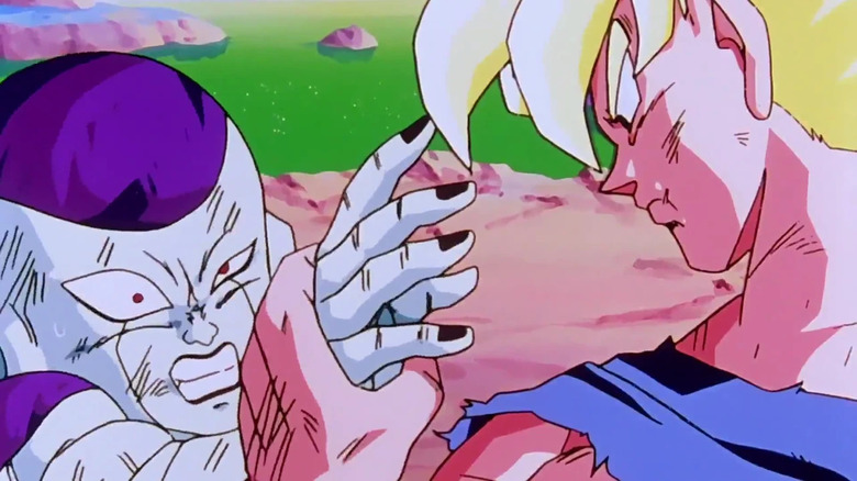 Super Saiyan Goku firmly grabs Frieza's hand in Dragon Ball Z