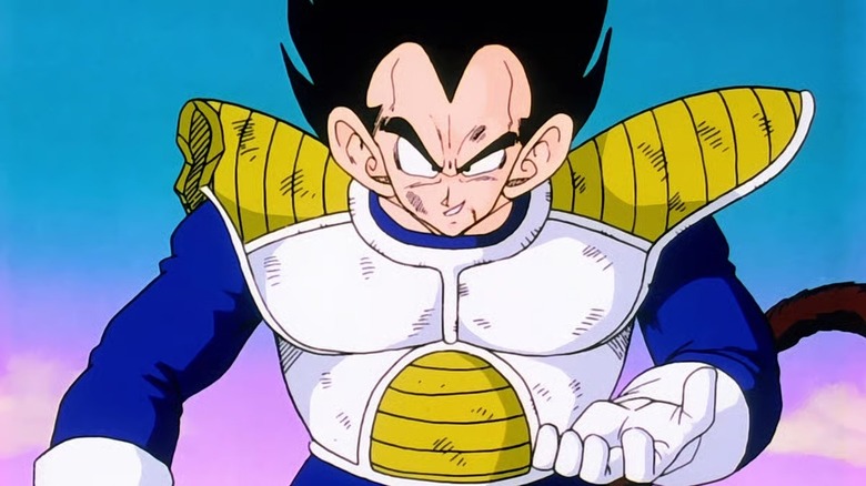A battered Vegeta prepares to create an energy ball in Dragon Ball Z