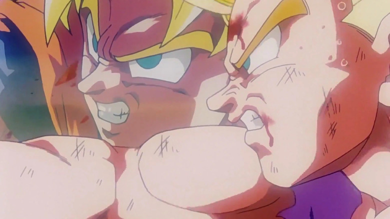Super Saiyan Goku stands next to Super Saiyan 2 Gohan in battle in Dragon Ball Z