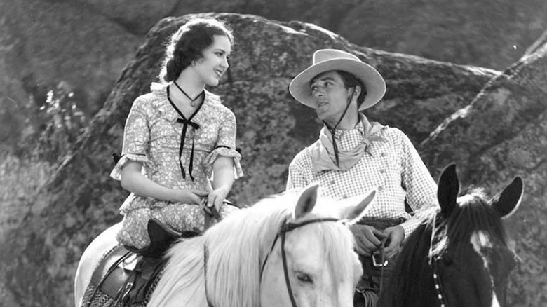 The Virginian (Gary Cooper) and Molly (Mary Brian) on horseback in The Virginian