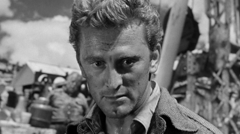 Chuck Tatum (Kirk Douglas) looks concerned in Ace In The Hole