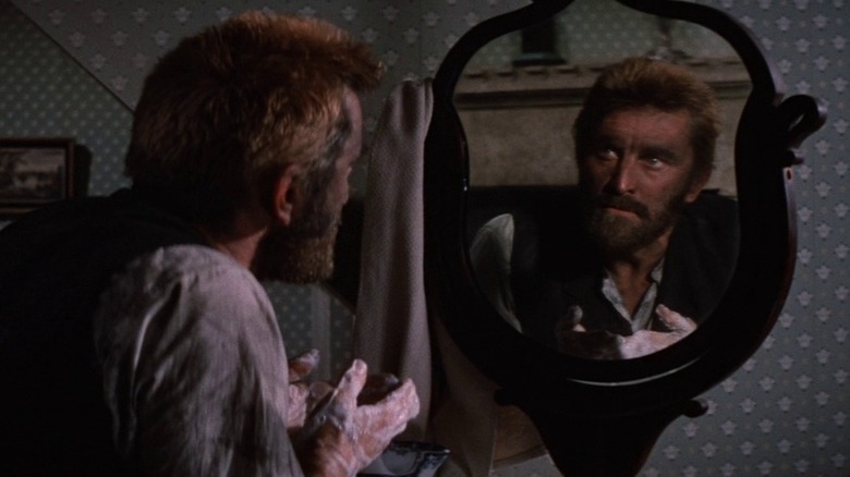 Vincent van Gogh (Kirk Douglas) looks in the mirror in Lust For Life