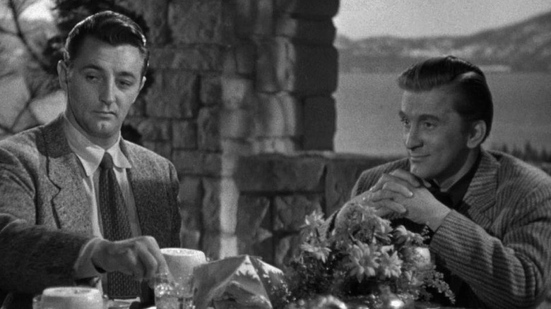 Jeff Bailey (Robert Mitchum) and Whit Sterling (Kirk Douglas) talking in Out of the Past