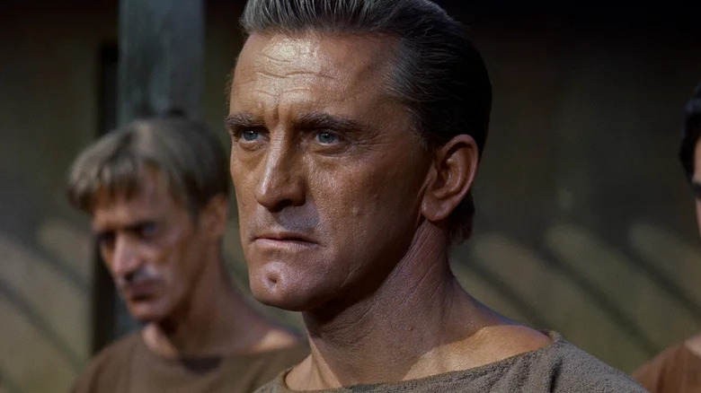 Spartacus (Kirk Douglas) looks worried in Spartacus
