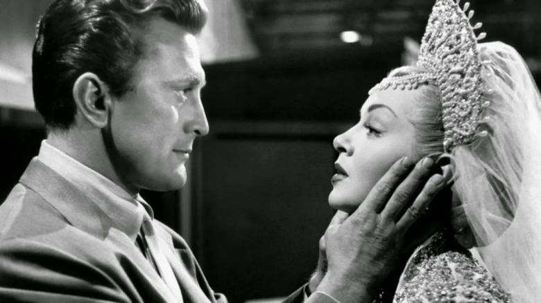 Jonathan Shields (Kirk Douglas) locks eyes with Georgia Lorrison (Lana Turner) in The Bad and The Beautiful