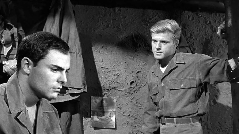 Roy Loomis (Robert Redford) confronts a downcast Raymond Endore (John Saxon) in War Hunt
