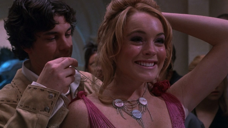 Adam Garcia as Stu putting necklace around smiling Lindsay Lohan as Lola in Confessions of a Teenage Drama Queen