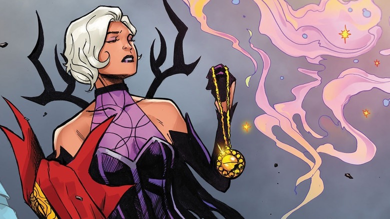 Clea next to a cloud of pink smoke holding Strange's cape and the Eye of Agamotto in a comic book panel