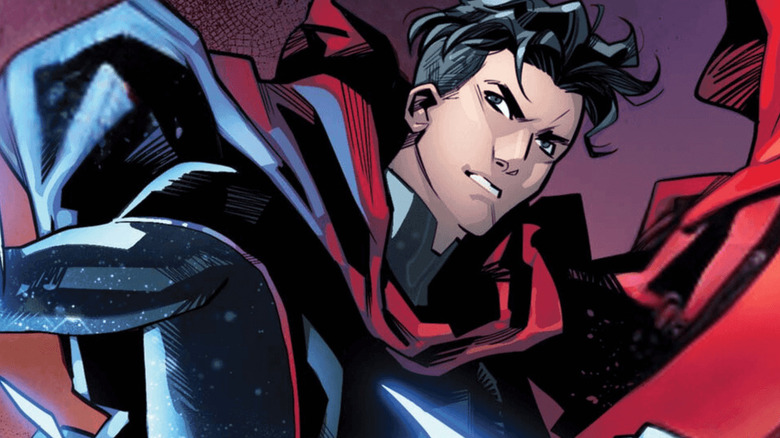 Wiccan wearing a red cape in a comic book panel
