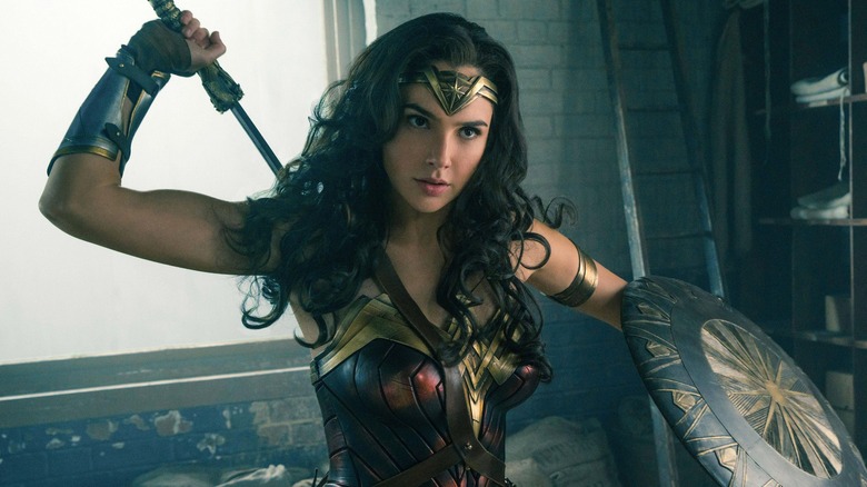Gal Gadot as Wonder Woman wielding a sword and shield in Wonder Woman 2017
