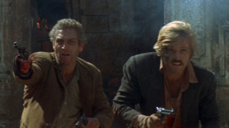 Butch Cassidy (Paul Newman) and the Sundance Kid (Robert Redford) with guns drawn in Butch Cassidy and the Sundance Kid