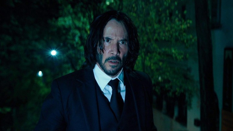 John Wick (Keanu Reeves) basked in light in John Wick: Chapter 4