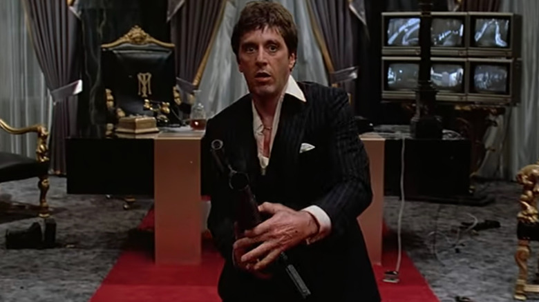 Tony Montana (Al Pacino) readying his gun in Scarface