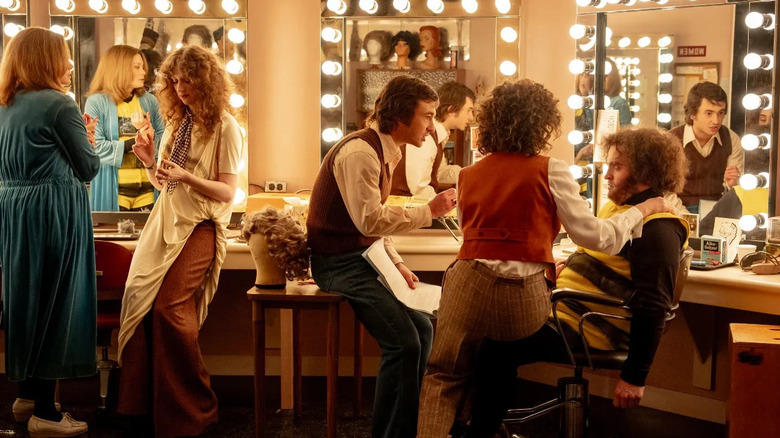 Jane Curtin and Laraine Newman look on as Lorne Michaels and Rosie Schuster give John Belushi a pep talk in Saturday Night