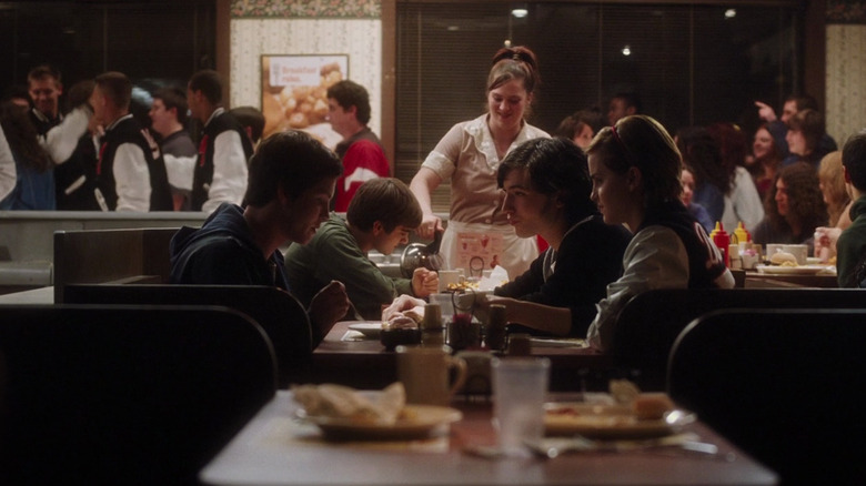 Charlie (Logan Lerman) sits with Patrick (Ezra Miller) and Sam (Emma Watson) in a diner in The Perks of Being a Wallflower